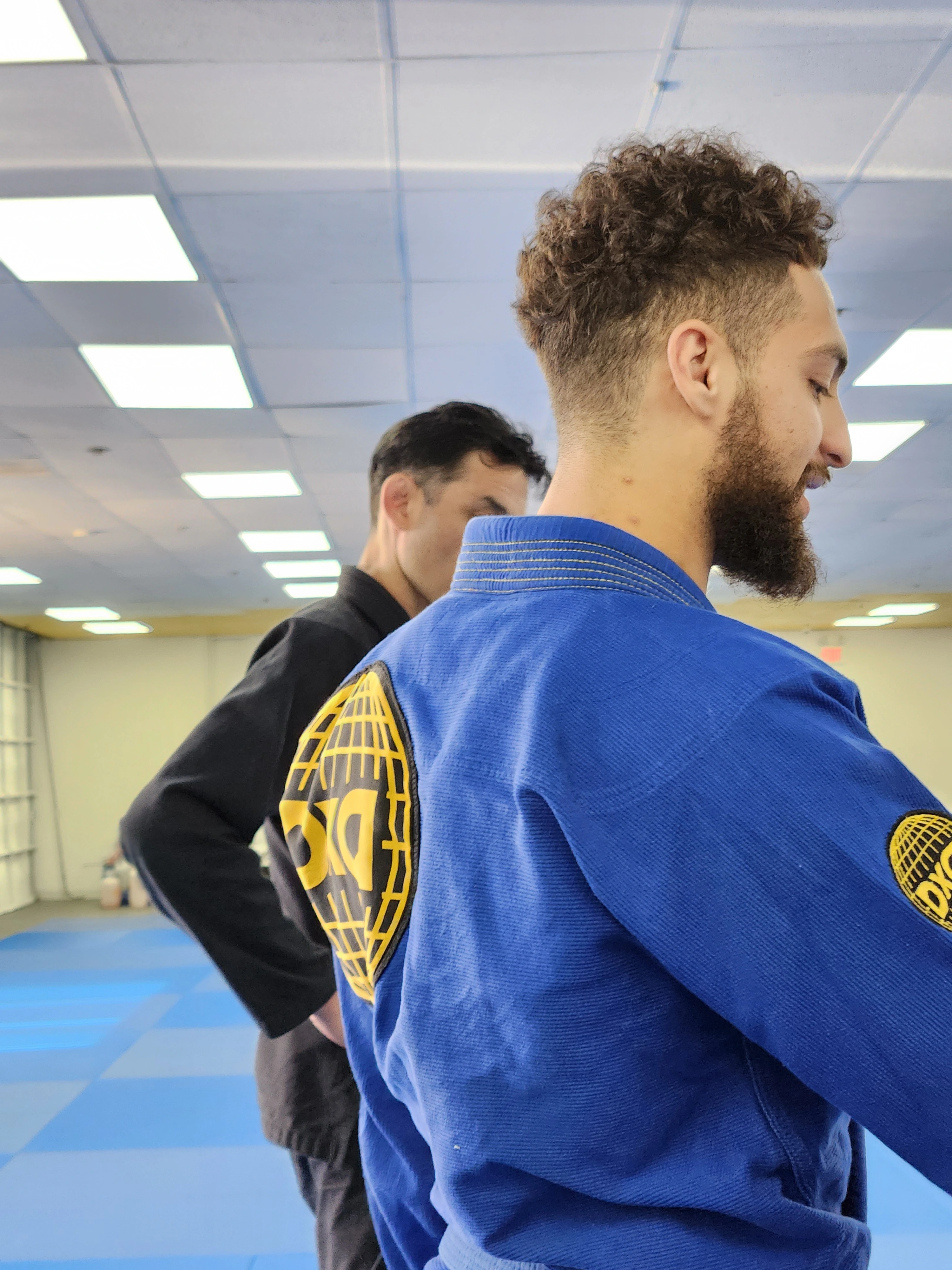 Happy adult BJJ training at Kuleana